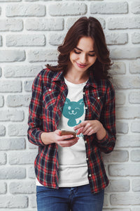 Cat-themed clothing. A girl wearing a white T-Shirt with a blue cat on it.